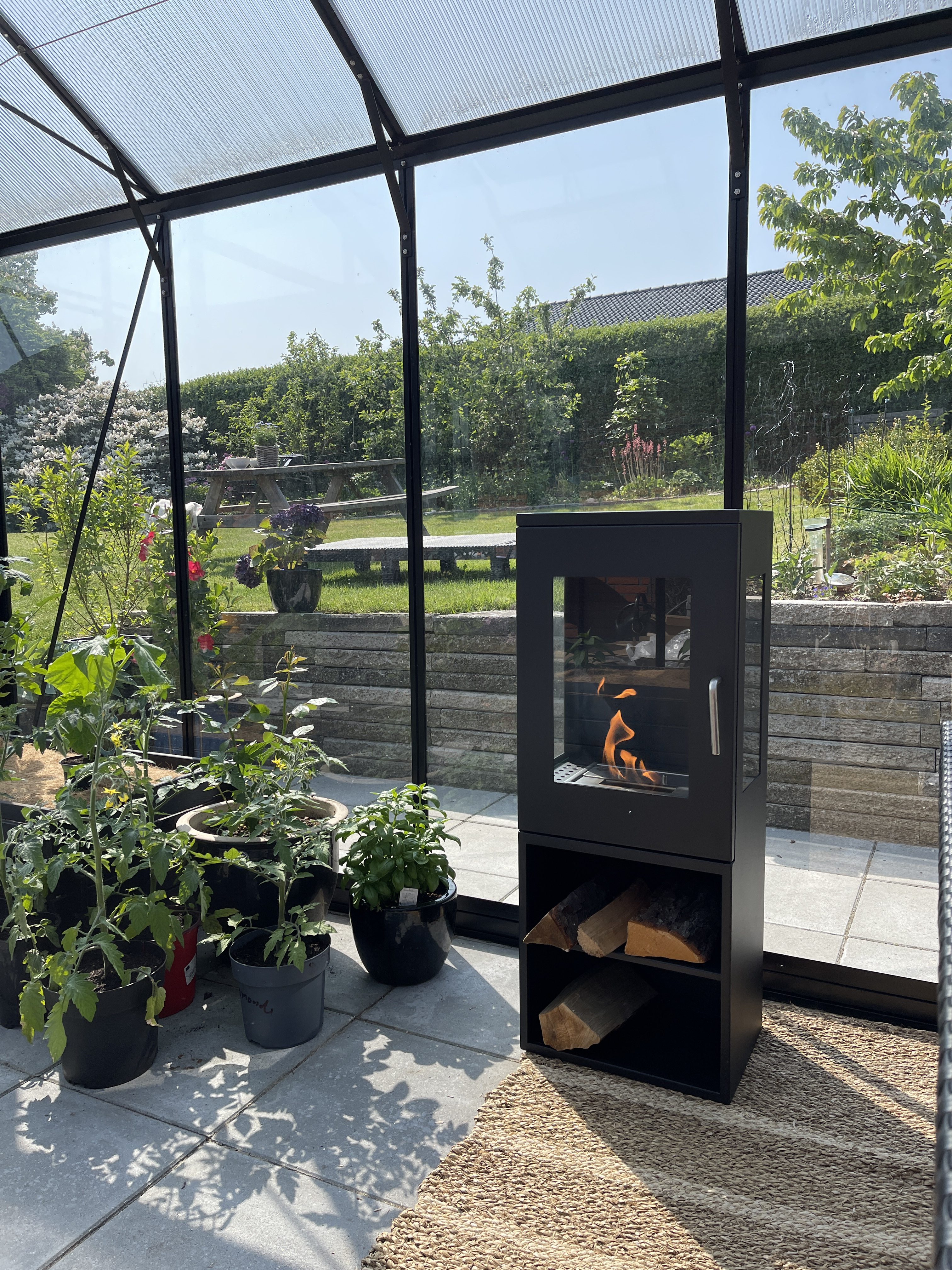 Bioethanol fireplace installed in a conservatory for added coziness.